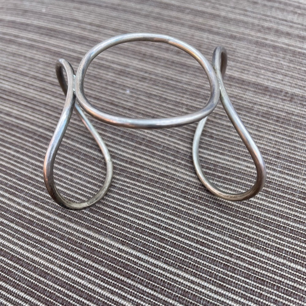 Woman’s silver bracelet.